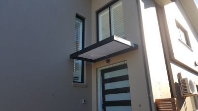 Slimline Awnings  - Black Frame  over a Door