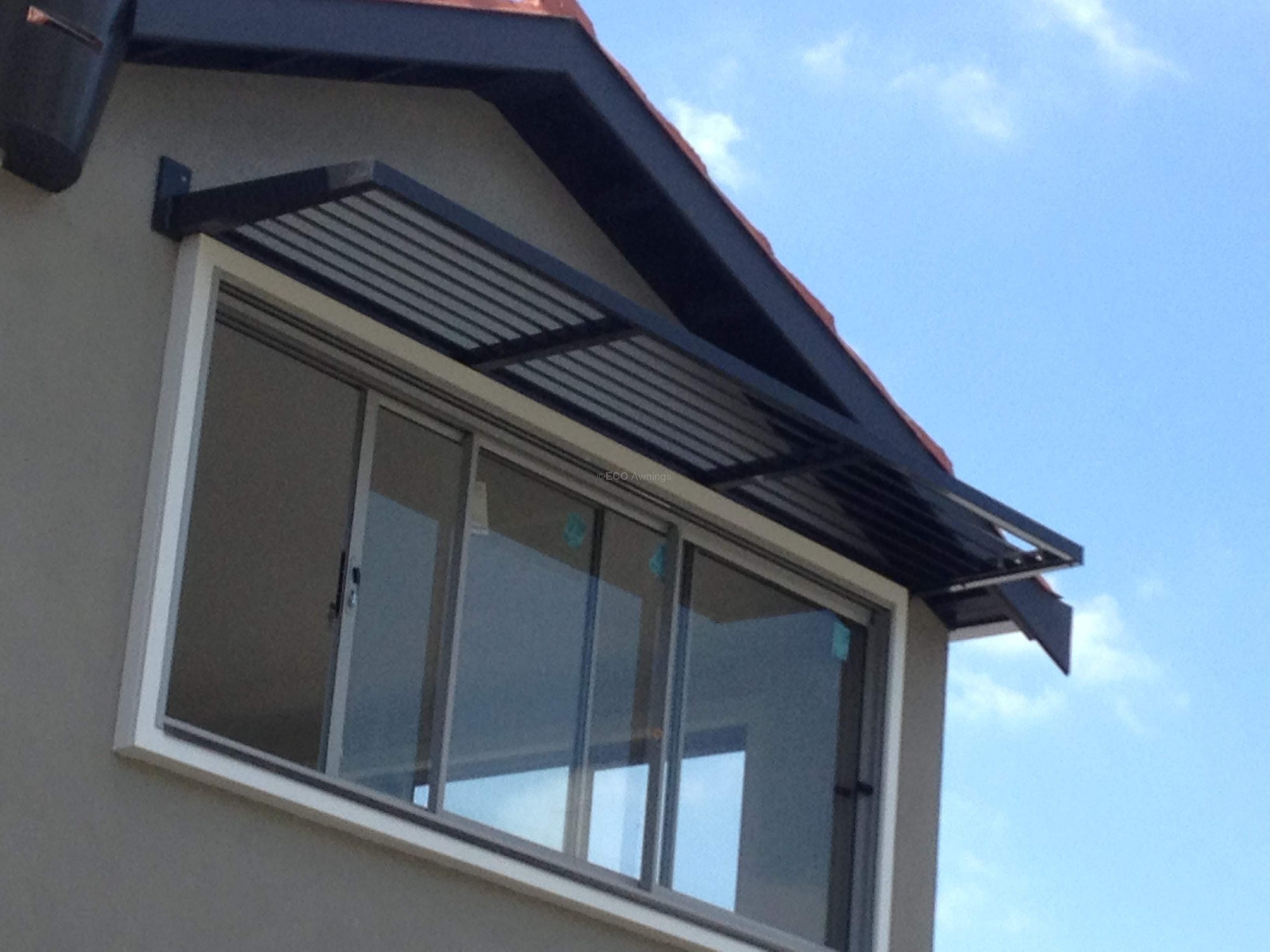 cantilever louver a window over. a window