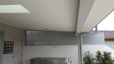 Privacy Screen Louvers  with fixed welded Louvers in a fixed frame running Vertically with a angled roof