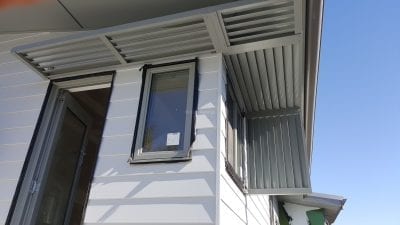 Canter Lever Louver  wrapped around a corner with a drop side privacy screen