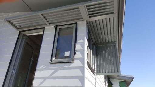 Canter Lever Louver  wrapped around a corner with a drop side privacy screen
