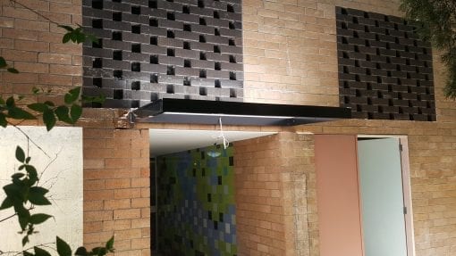 Slimline awning over a door way in to a block of units