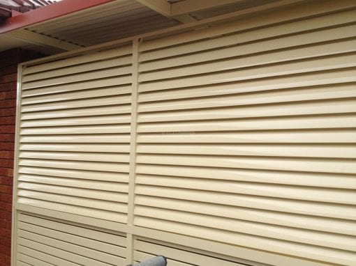 Slat fence with louvre s on top