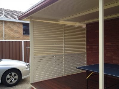 Slat fence with louvre s on top