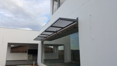 Canter Lever Louvers mounted above Glass door