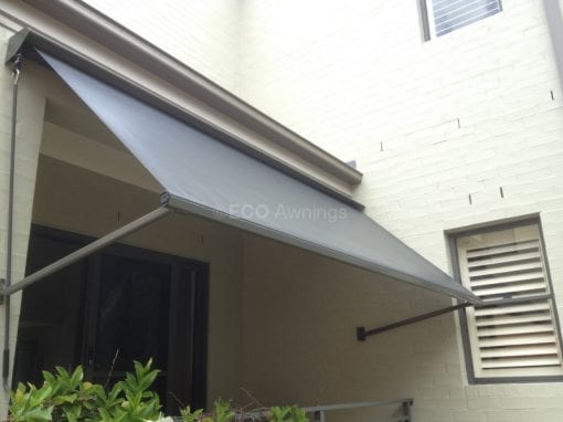 Pivot arm fabric awnings
