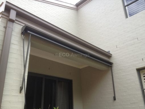 Pivot arm fabric awnings