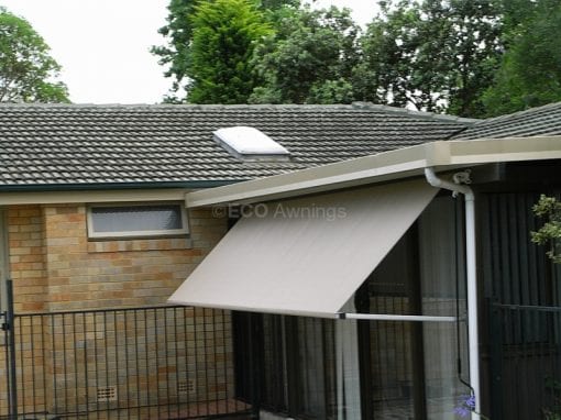 Pivot arm fabric awnings