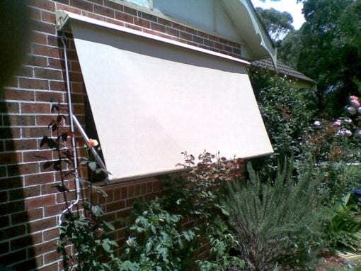 Pivot arm fabric awnings