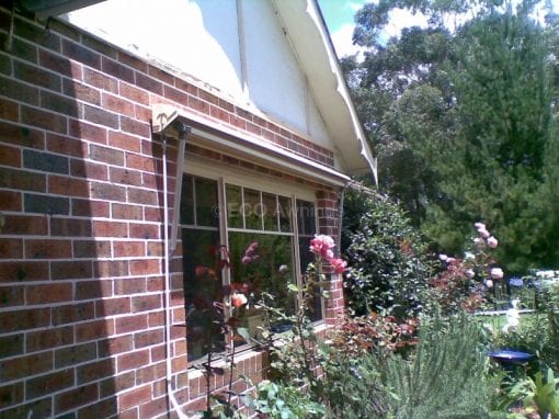 Pivot arm fabric awnings