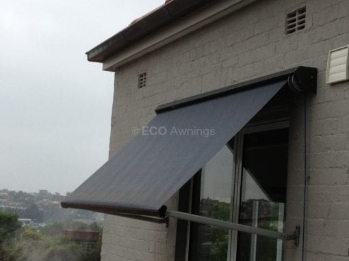 Pivot arm fabric awnings